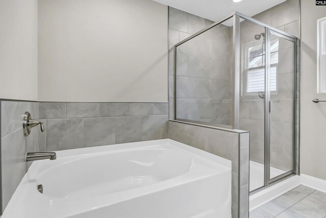 bathroom featuring tile patterned floors and plus walk in shower