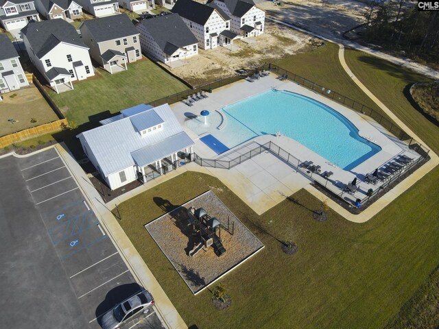 view of swimming pool with a lawn and a patio