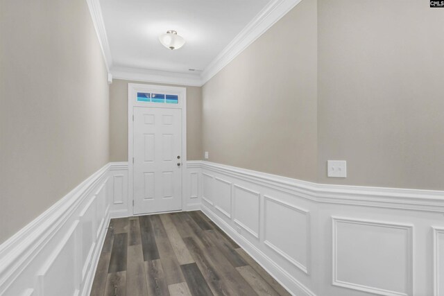 doorway featuring crown molding and dark hardwood / wood-style floors