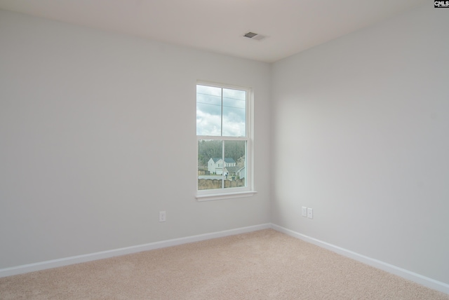 unfurnished room with carpet floors