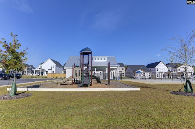 view of playground featuring a lawn