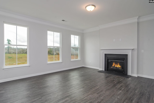 unfurnished living room featuring dark wood-type flooring and ornamental molding