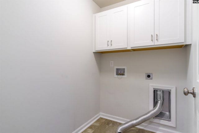 clothes washing area with washer hookup, electric dryer hookup, and cabinets