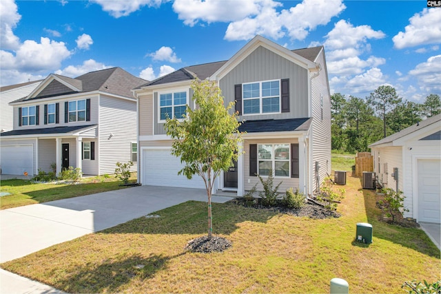 view of front facade with cooling unit, a garage, and a front yard