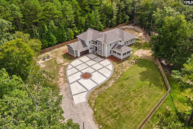 drone / aerial view with a wooded view