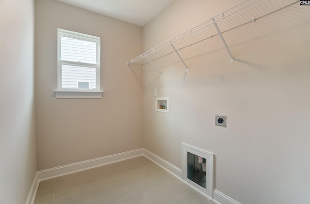 clothes washing area with washer hookup and electric dryer hookup