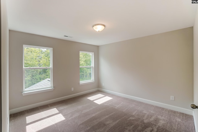 unfurnished room featuring carpet flooring