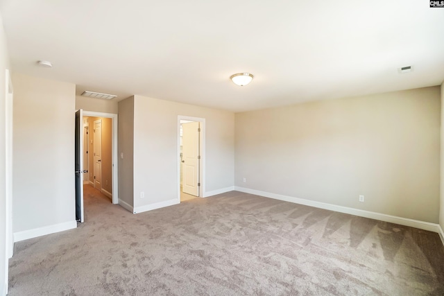 empty room with light colored carpet