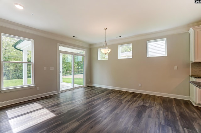 unfurnished dining area featuring crown molding and dark wood-type flooring