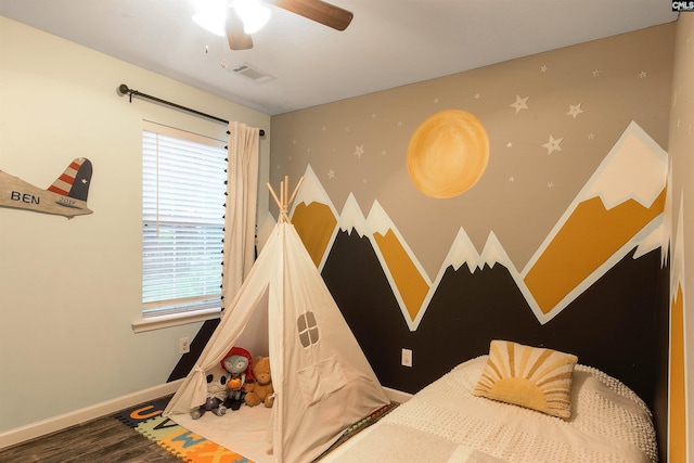 bedroom featuring ceiling fan and hardwood / wood-style flooring