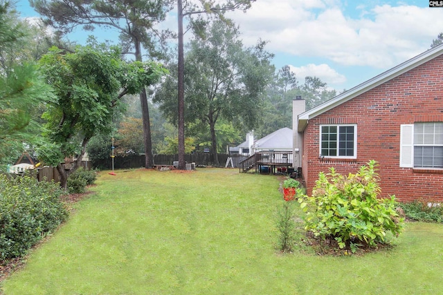 view of yard with a wooden deck