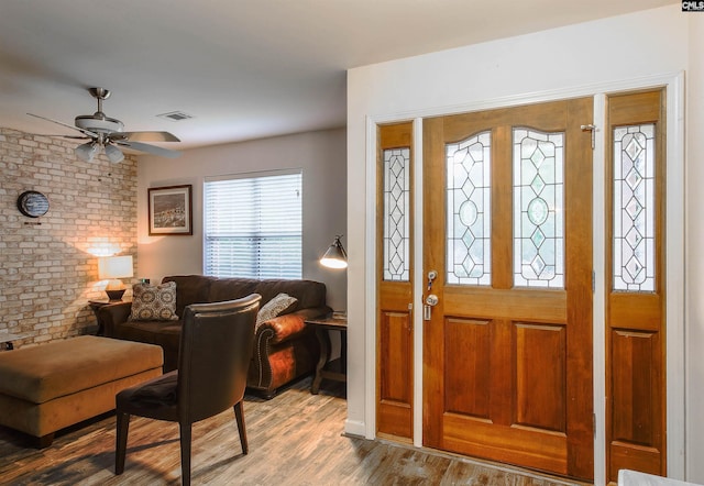 entrance foyer featuring ceiling fan and hardwood / wood-style flooring