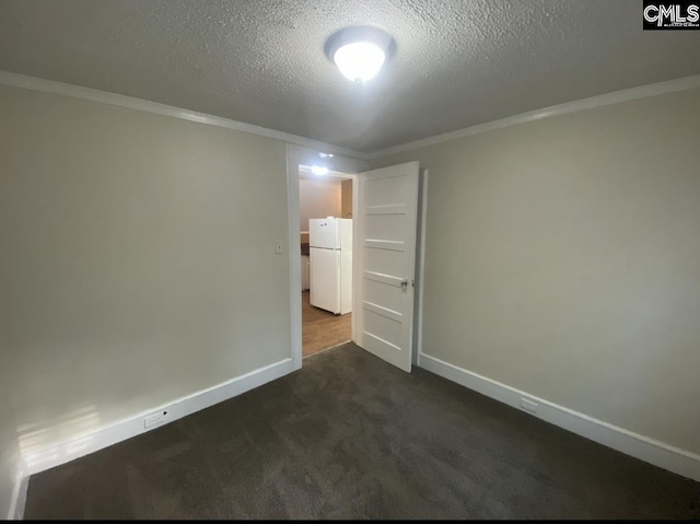 unfurnished room featuring a textured ceiling, baseboards, dark carpet, and ornamental molding