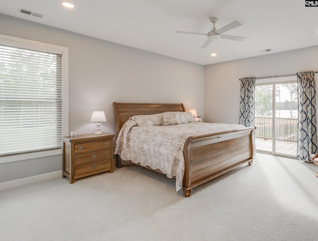 bedroom with access to exterior, ceiling fan, and light colored carpet