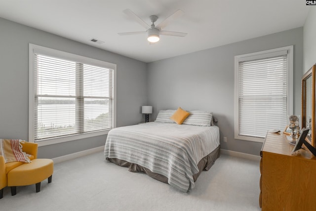 bedroom featuring ceiling fan and light colored carpet