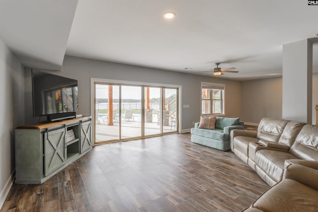 living room with hardwood / wood-style floors and ceiling fan