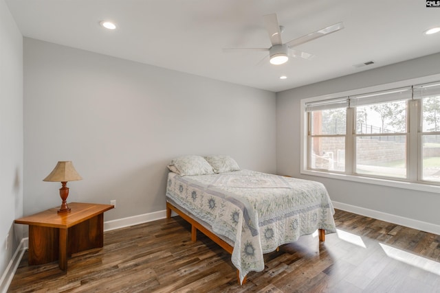 bedroom featuring dark wood-type flooring and ceiling fan