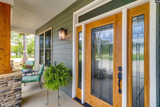 property entrance with covered porch