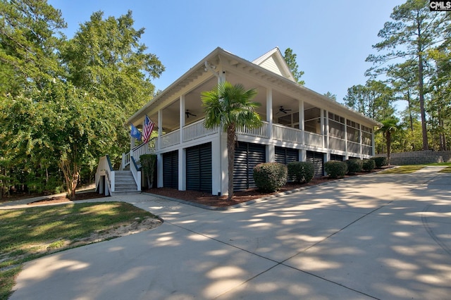 exterior space with ceiling fan