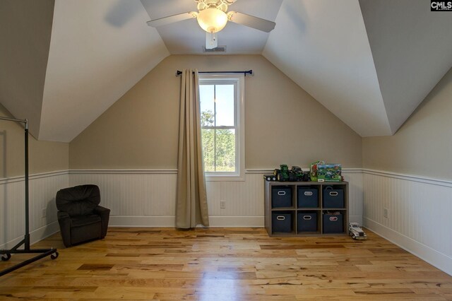 additional living space featuring lofted ceiling, ceiling fan, and light hardwood / wood-style floors