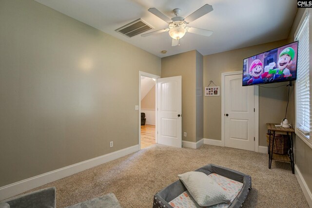 carpeted bedroom featuring ceiling fan