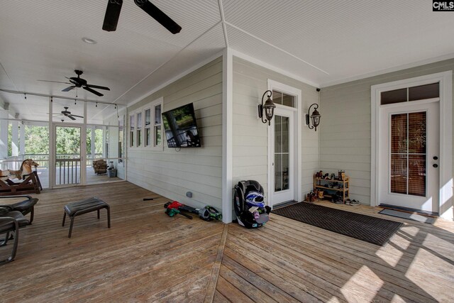 wooden terrace featuring ceiling fan