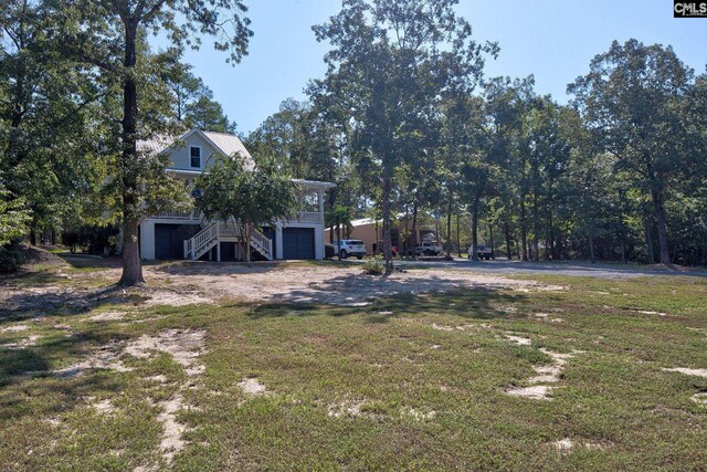 view of yard with a garage