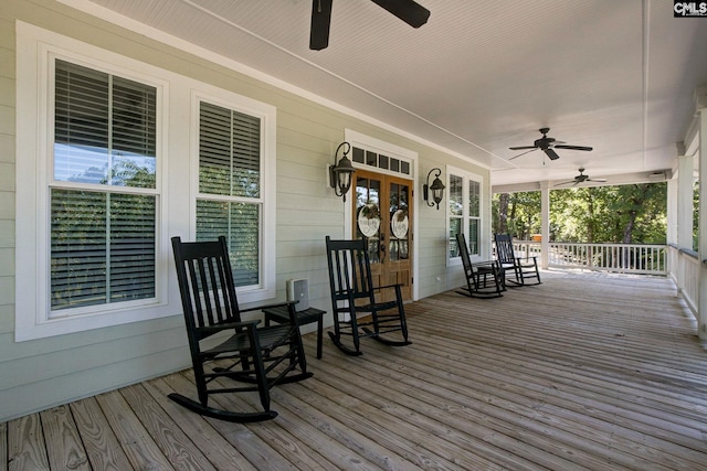 wooden deck featuring ceiling fan and covered porch