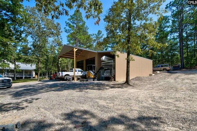 view of vehicle parking featuring a carport