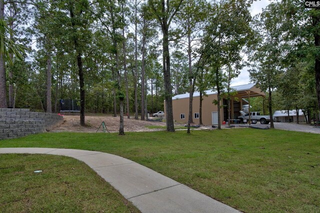 view of property's community featuring a yard