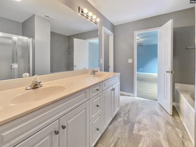 full bathroom with a sink, visible vents, a stall shower, and double vanity