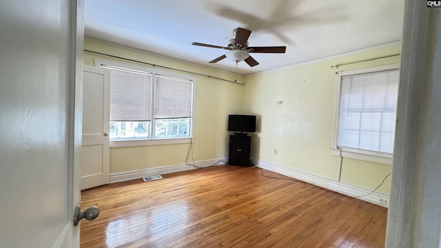 1926 Middleton St, Orangeburg, SC 29115 - spare room with baseboards, wood finished floors, visible vents, and ceiling fan