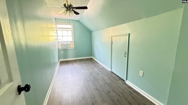 bonus room with ceiling fan, wood-type flooring, and vaulted ceiling