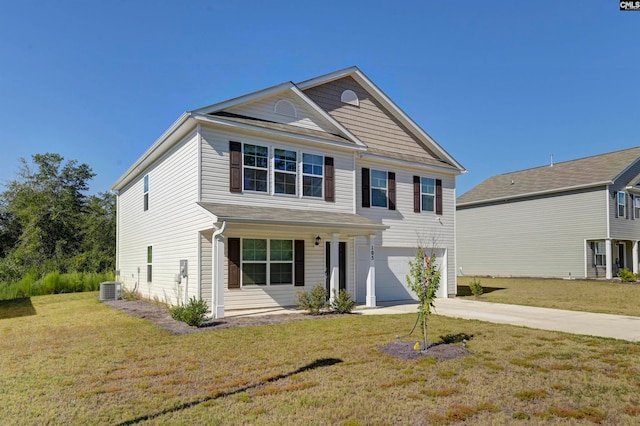 view of front facade with a garage, central AC, and a front yard