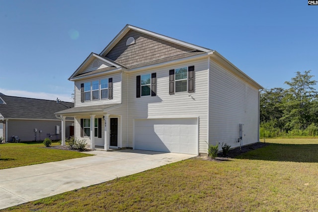 view of front of home featuring a garage and a front yard