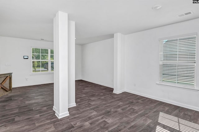 spare room featuring dark hardwood / wood-style flooring