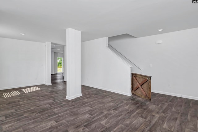 basement featuring dark hardwood / wood-style floors