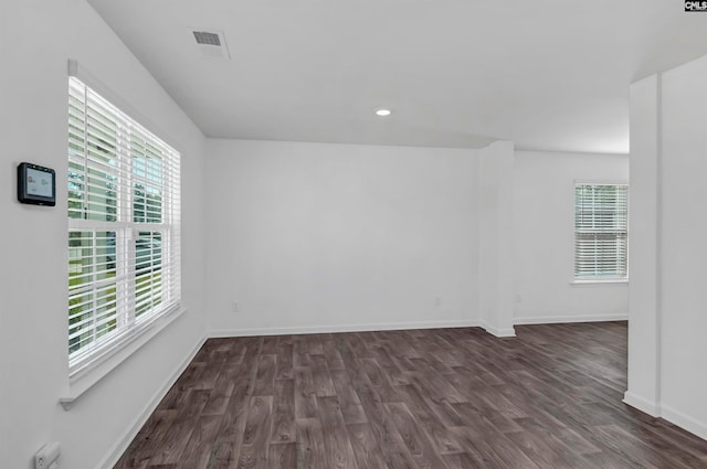 spare room featuring dark hardwood / wood-style floors