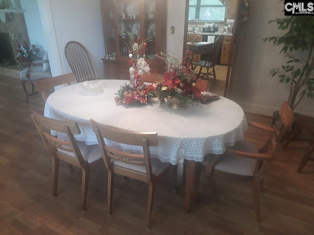 dining area featuring dark hardwood / wood-style floors