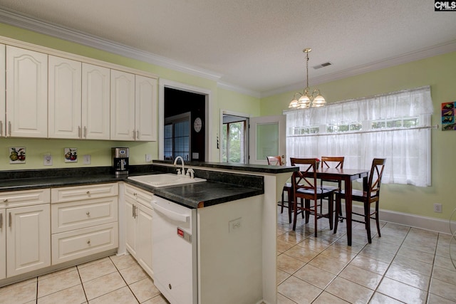 kitchen with a notable chandelier, a textured ceiling, dishwasher, kitchen peninsula, and sink