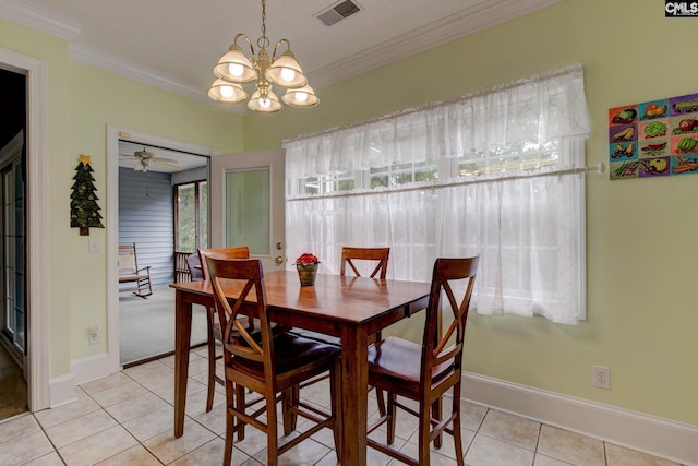 tiled dining area with ceiling fan with notable chandelier and ornamental molding