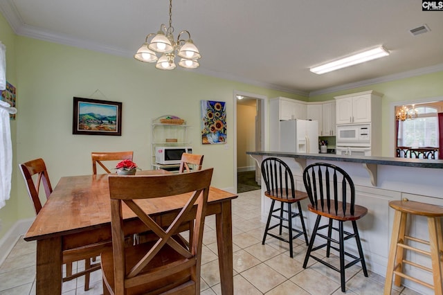 tiled dining area with ornamental molding and a chandelier