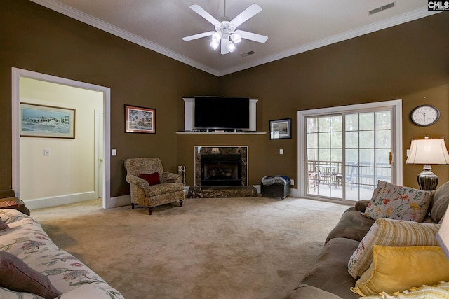 carpeted living room featuring a high ceiling, ceiling fan, a fireplace, and ornamental molding