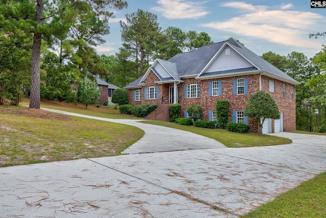 view of front of home featuring a garage and a front yard