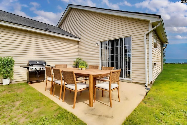 view of patio with grilling area and outdoor dining area