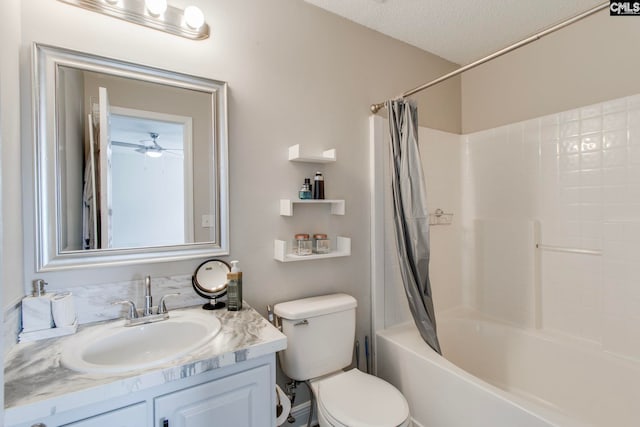 bathroom featuring toilet, vanity, shower / bath combination with curtain, a textured ceiling, and a ceiling fan