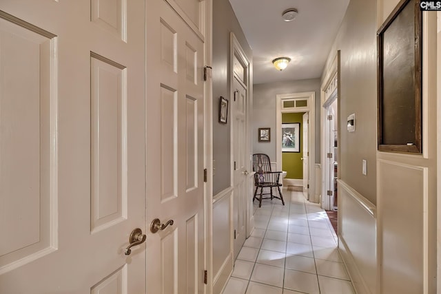 hall with light tile patterned flooring