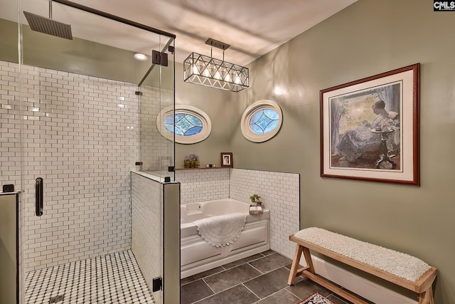 bathroom with shower with separate bathtub