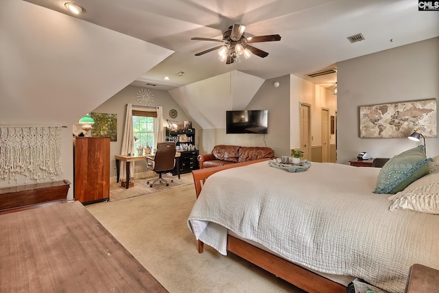 bedroom with light colored carpet, ceiling fan, and vaulted ceiling