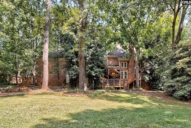 view of yard featuring a wooden deck